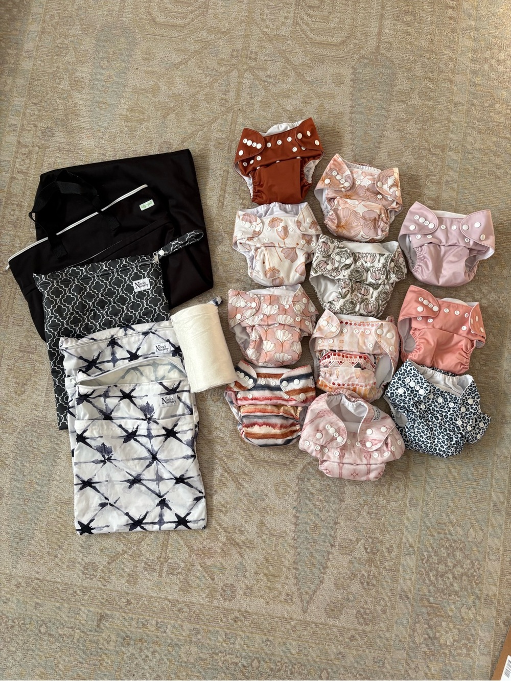 Nora’s nursery diapers set of 11 in pink colors and patterns with wet bags